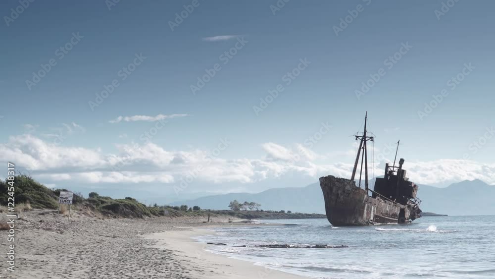 An old abandoned shipwreck, wrecked boat sunken ship stand on beach coast. Accident at sea 4K. An old abandoned shipwreck, wrecked boat sunken ship stand on beach coast. Accident at sea 4K.