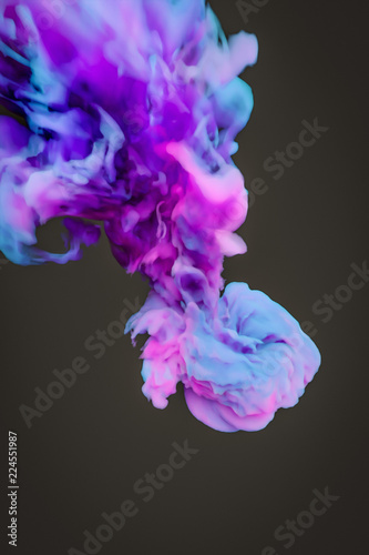 a colorful blue pink ink splash in water