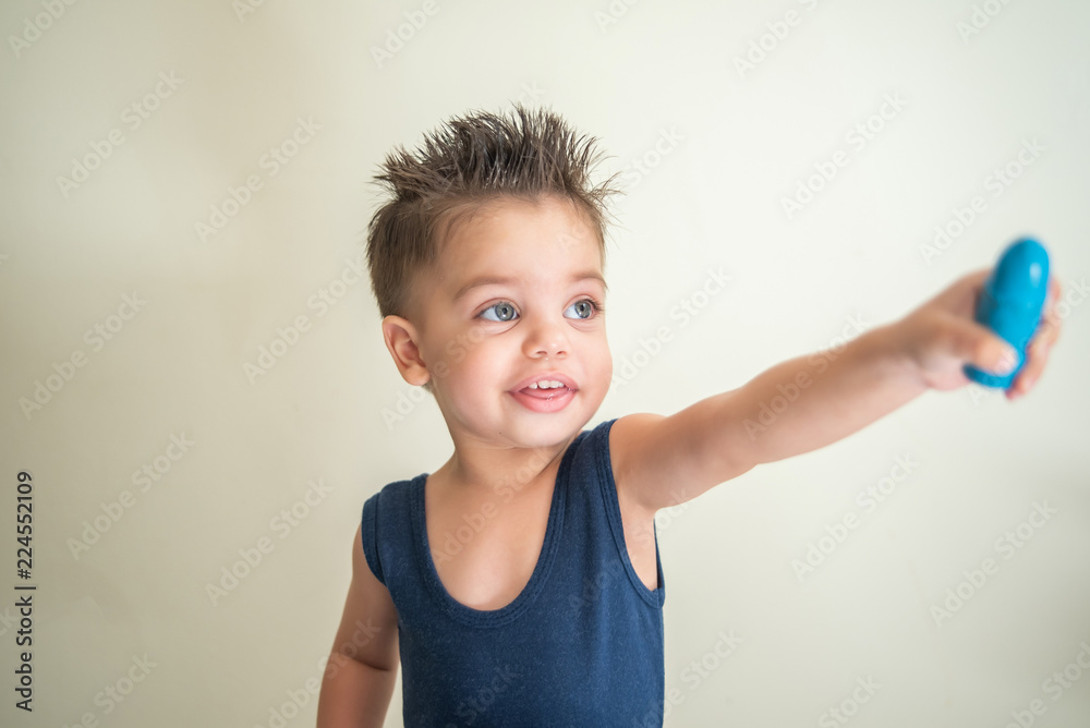 Cute baby boy toddler - holding the crayons Cute baby boy toddler - holding the crayons