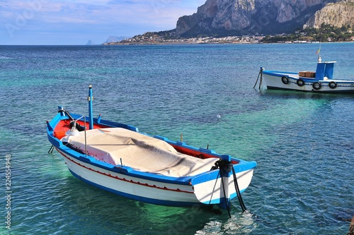 Palermo, Sicily, Italy. Colorful fishing boat in the sea in front of Mondello.