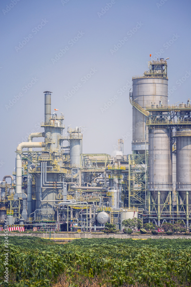 Chemical refinery plant with blue sky , soft tone color