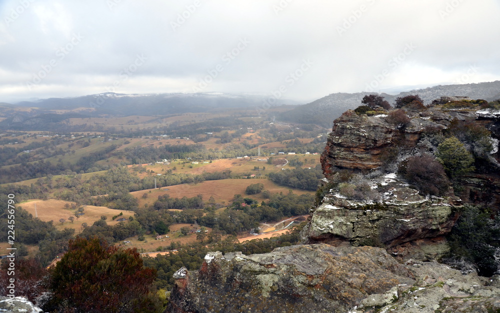 The scenic view from Hassans Wall in Lithgow. Snow collected on escarpments at Lithgows Hassans Wall lookout in New South Wales, Australia.