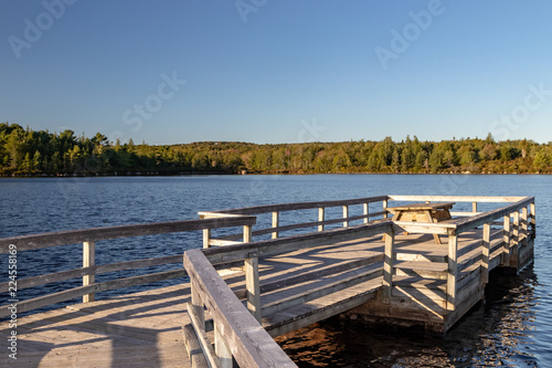 wooden pier on the lake at sunset