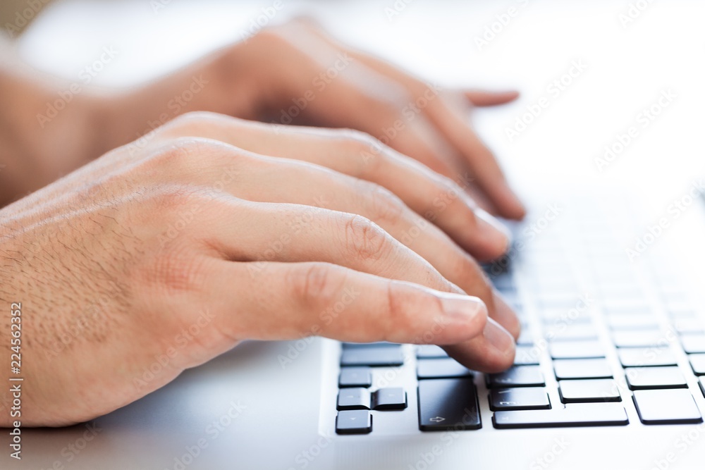 Closeup of a Man Typing on a Laptop Closeup of a Man Typing on a Laptop