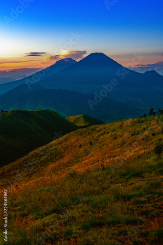 Fototapeta Naklejka Na Ścianę i Meble -  Mount Merapi and Merbabu in the background taken from mount Prau, Jogjakarta, Indonesia