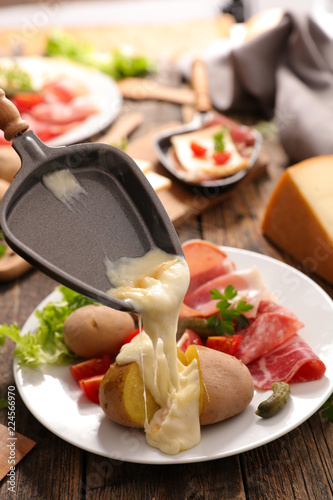 Canvas Print raclette cheese with potato and meat