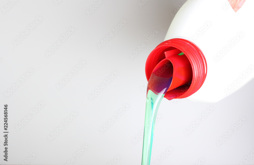 bottle of liquid detergent in hand bottle of liquid detergent in hand