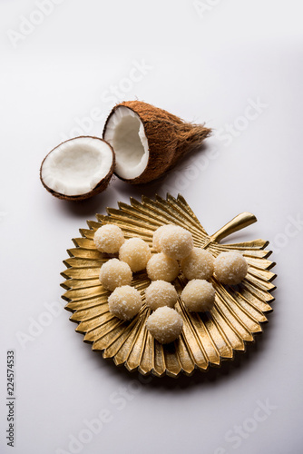 Coconut Sweet Laddoo OR Nariyal Ladduis a Popular Festival food from India. Served over moody background, selective focus photo