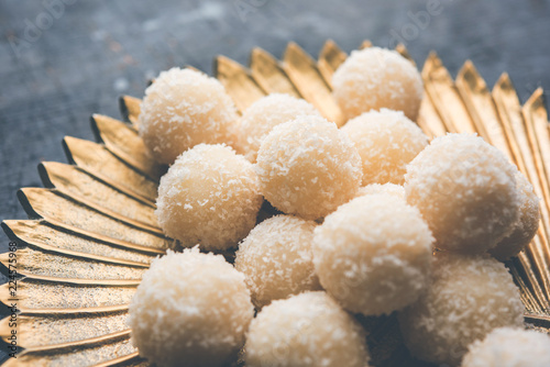 Coconut Sweet Laddoo OR Nariyal Ladduis a Popular Festival food from India. Served over moody background, selective focus photo