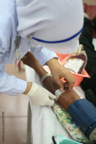 nurses helping to make blood donation.