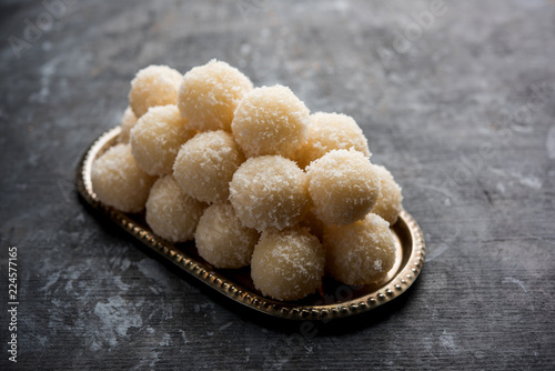 Coconut Sweet Laddoo OR Nariyal Ladduis a Popular Festival food from India. Served over moody background, selective focus photo