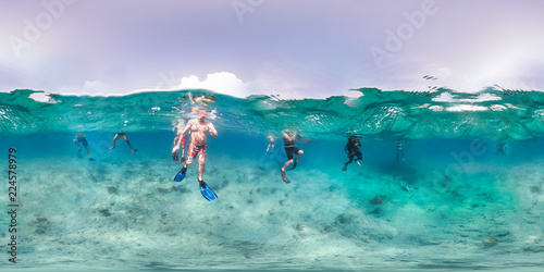 Tourists swimming in ocean © The Ocean Agency