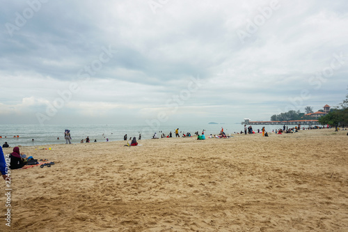 View of crowd spending time at the beach Port Dickson, Malaysia photo