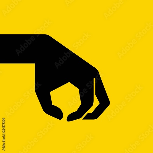 crushing hand on yellow background