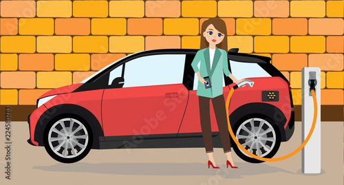 Woman charges an electric car at a charging station for electric vehicles.