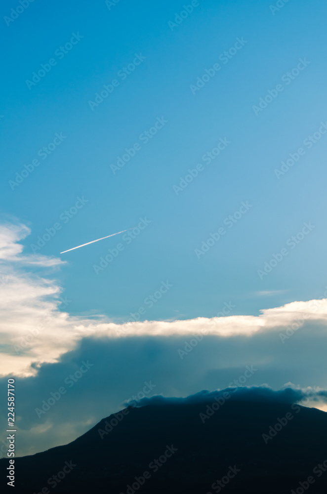 Fototapeta premium clouds as crown to mountain