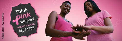 Composite image of two black women joining hands photo