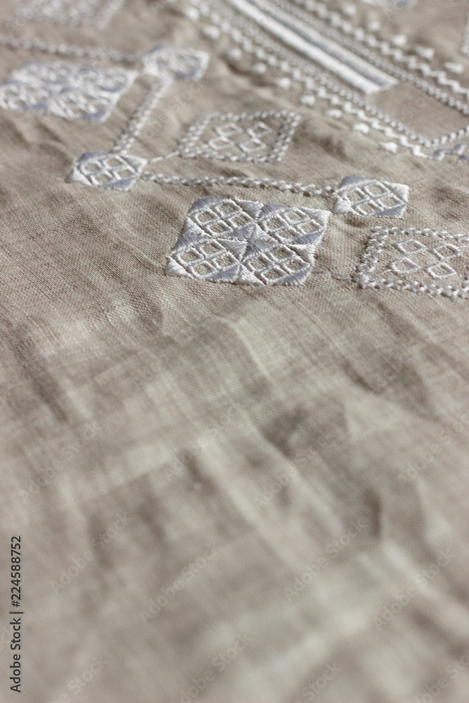 Embroidered linen shirt, white ornament, close Embroidered linen shirt, white ornament, close