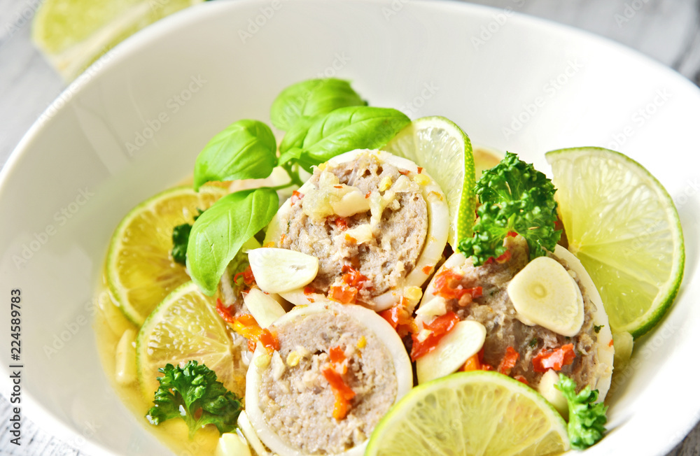 steamed filled squid in lime sauce (Thai name is Pla Muk Nung Manow)..Squid and minced pork homemade menu. steamed filled squid in lime sauce (Thai name is Pla Muk Nung Manow)..Squid and minced pork homemade menu.