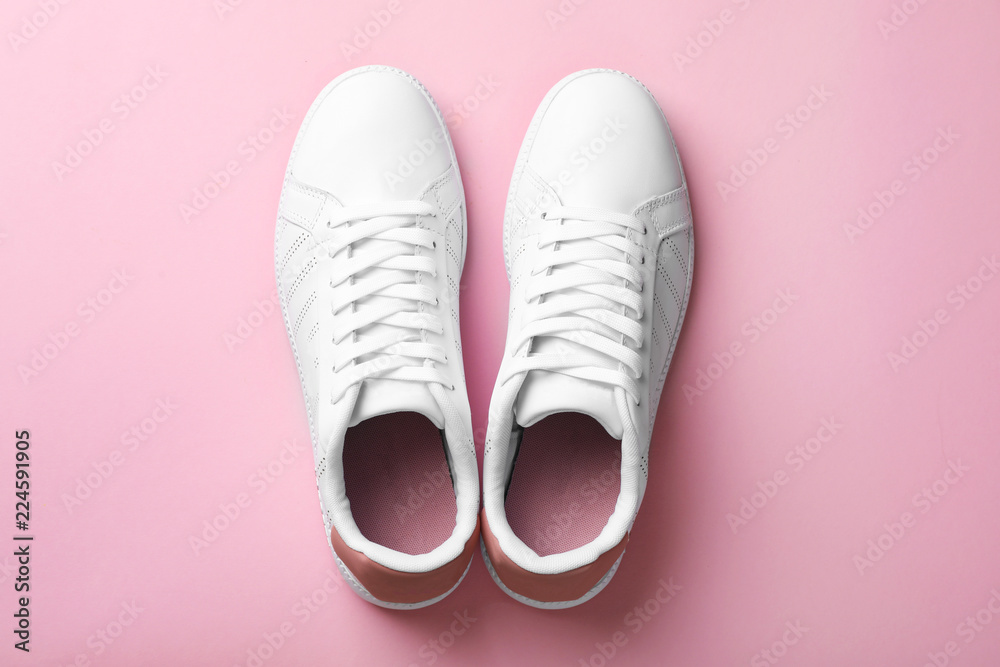 Pair of sneakers on color background, flat lay Pair of sneakers on color background, flat lay