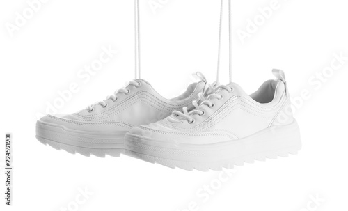 New stylish sneakers on white background. Trendy footwear