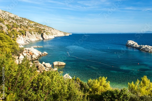 Fototapeta Naklejka Na Ścianę i Meble -  Island of Hvar. A place for a peaceful holiday. Coastal rocks in the Adriatic Sea. Blue sky.