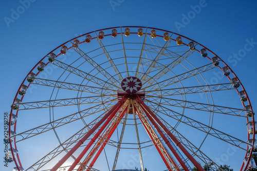 Ferris wheel on cloudy sky background amusement park carnival
