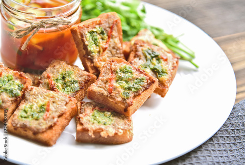Fried toasts with Minced Pork Spread with chili sauce (Thai Pork Toast) . Toasts Menu for children.