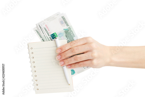 Hand with Russian rubles and notebook, isolated on white