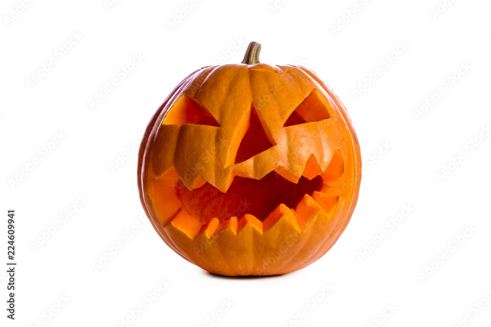 Fototapeta premium Orange pumpkin carved into creepy and funny Jack o Lantern isolated on white background. All hallows night. Copy space, close up, top view. Halloween party decoration. Trick or treat concept.