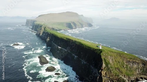 Aerial view of the beautiful Mykines island in Faroe Islands during a sunny day of spring