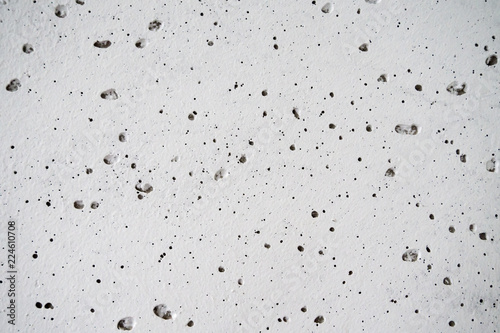 white concrete wall with bubbles