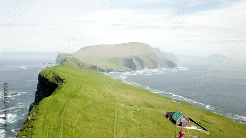 Aerial view of the beautiful Mykines island in Faroe Islands during a sunny day of spring