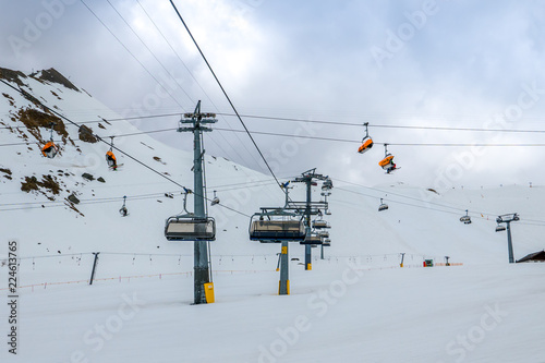 Multiple levels of chairlifts operating in ski resort