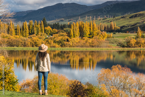Woman staring lake wakatipu, Queenstown, New Zealand photo