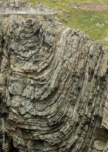 Bsckground of wavy rock formation at cliff face