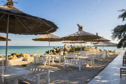 Fototapeta Naklejka Na Ścianę i Meble -  Empty cafe bar on the public beach in the early morning