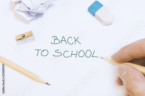 Hand is writing on whiteboard back to school idea concept