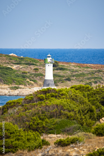 A beautiful lighthouse during a sunny day in Sardinia, Italy.
