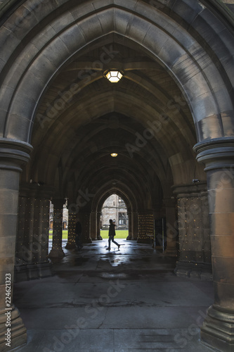 Student walking in the Glasgow University Cloisters © Espen