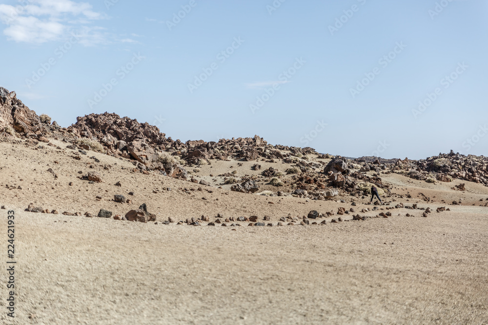 Beautiful landscape with large brown rocks and sand on the island of Tenerife, on a sunny day