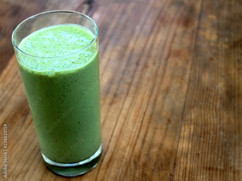 Green smoothie in a tall glass Green smoothie in a tall glass