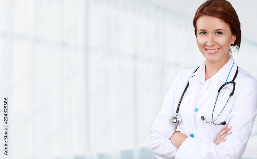Attractive young female doctor on background Attractive young female doctor on background