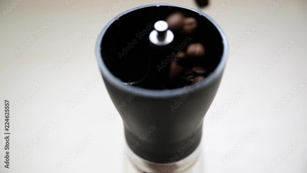 Filling up my coffee grinder with new beans before grinding. Filling up my coffee grinder with new beans before grinding.