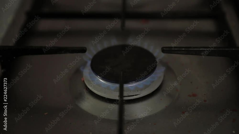 Ignition of the gas stove in the afternoon before cooking in slow motion Ignition of the gas stove in the afternoon before cooking in slow motion