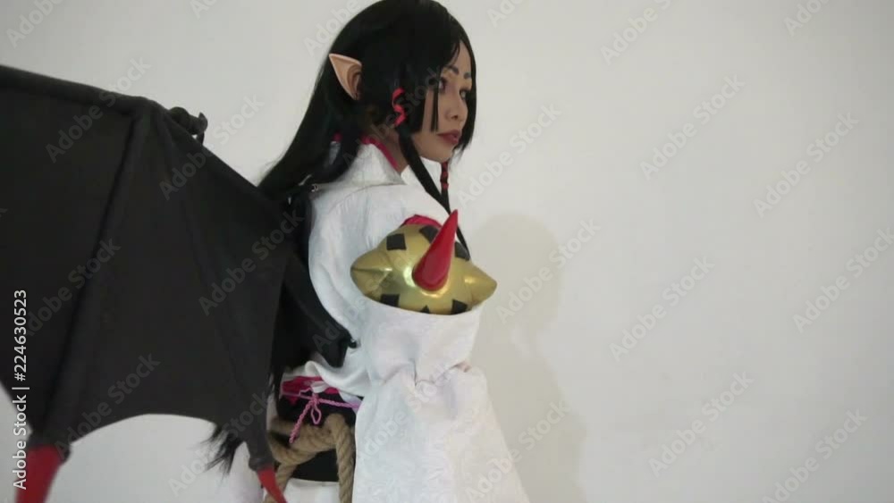Portrait of beautiful asian girl wear cosplay game animation on white background,Thailand people,Red cloths devil style	