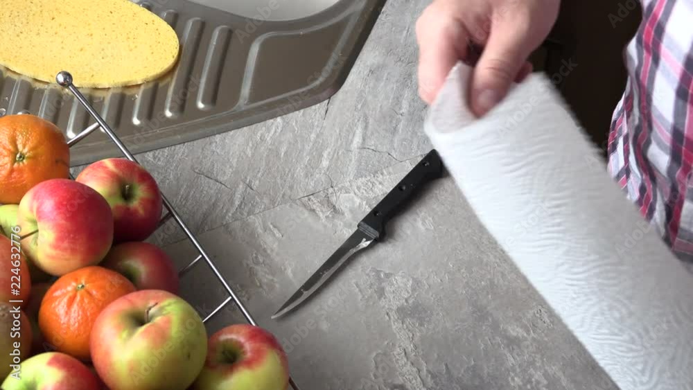 The man is sharpening a kitchen knife