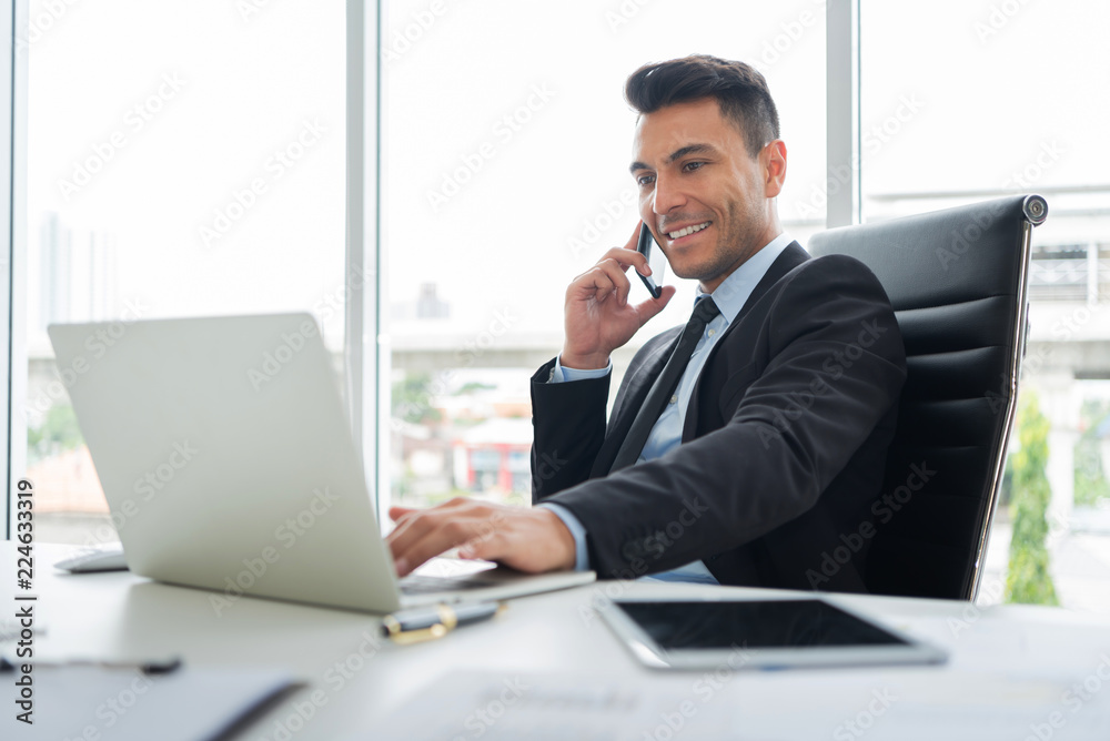 Successful of Young Businessman is using cell phone. Successful of Young Businessman is using cell phone.