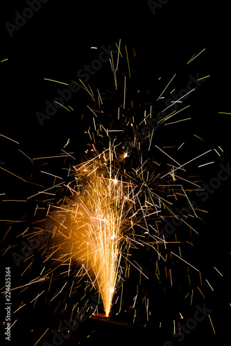 Celebratory fireworks on black background portrait orientation room for text