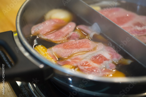 Closeup of sliced pork in hot pot